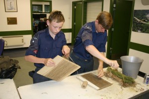 Steps 4-6 - Louden and Braeken Gray making piles of string for the suit